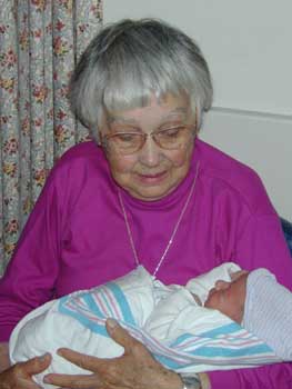 Oma holding Drew in the hospital