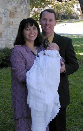 Cameron with Mum and Dad at his christening